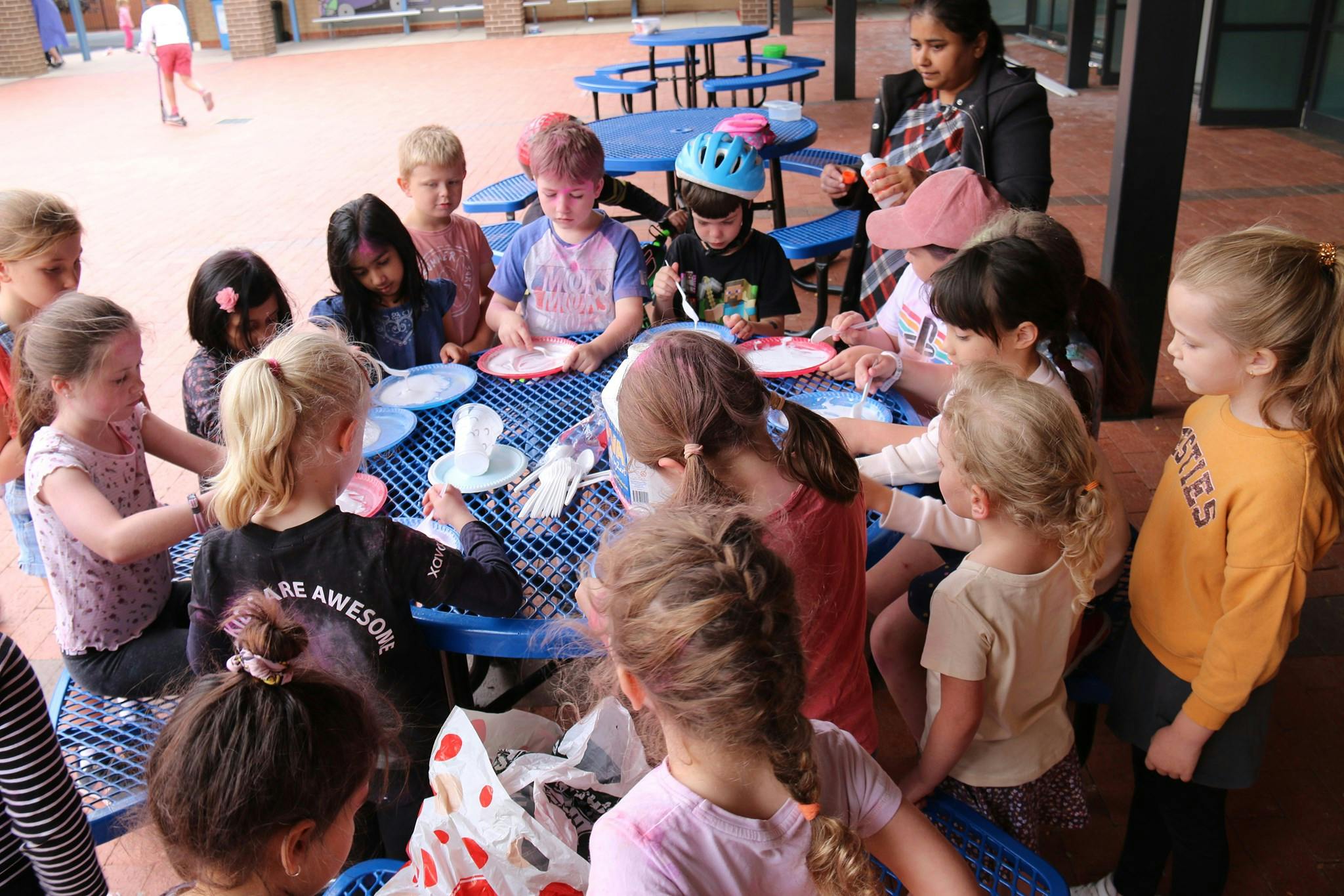 A group of children at one of our School Holiday programs playing games on a table.